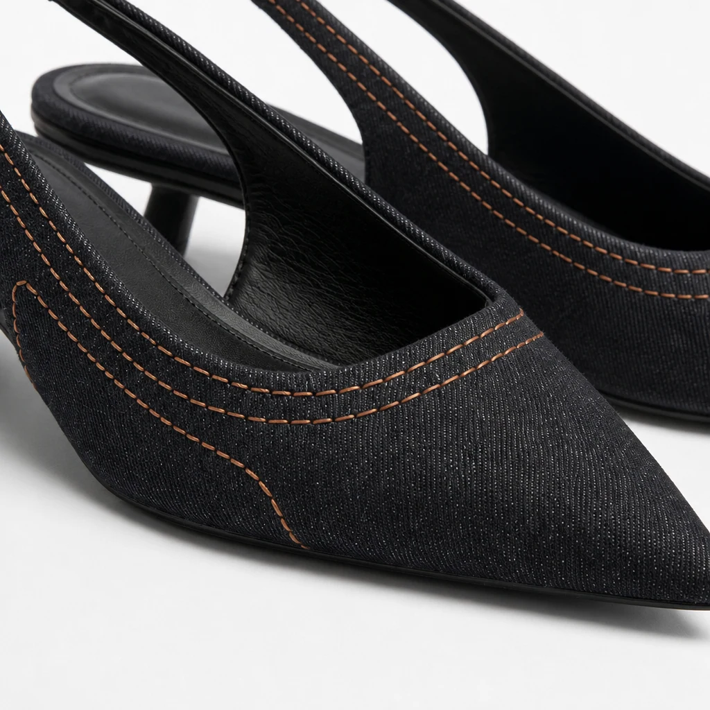 Close-up detail of slingback heel trim and microfiber leather finish