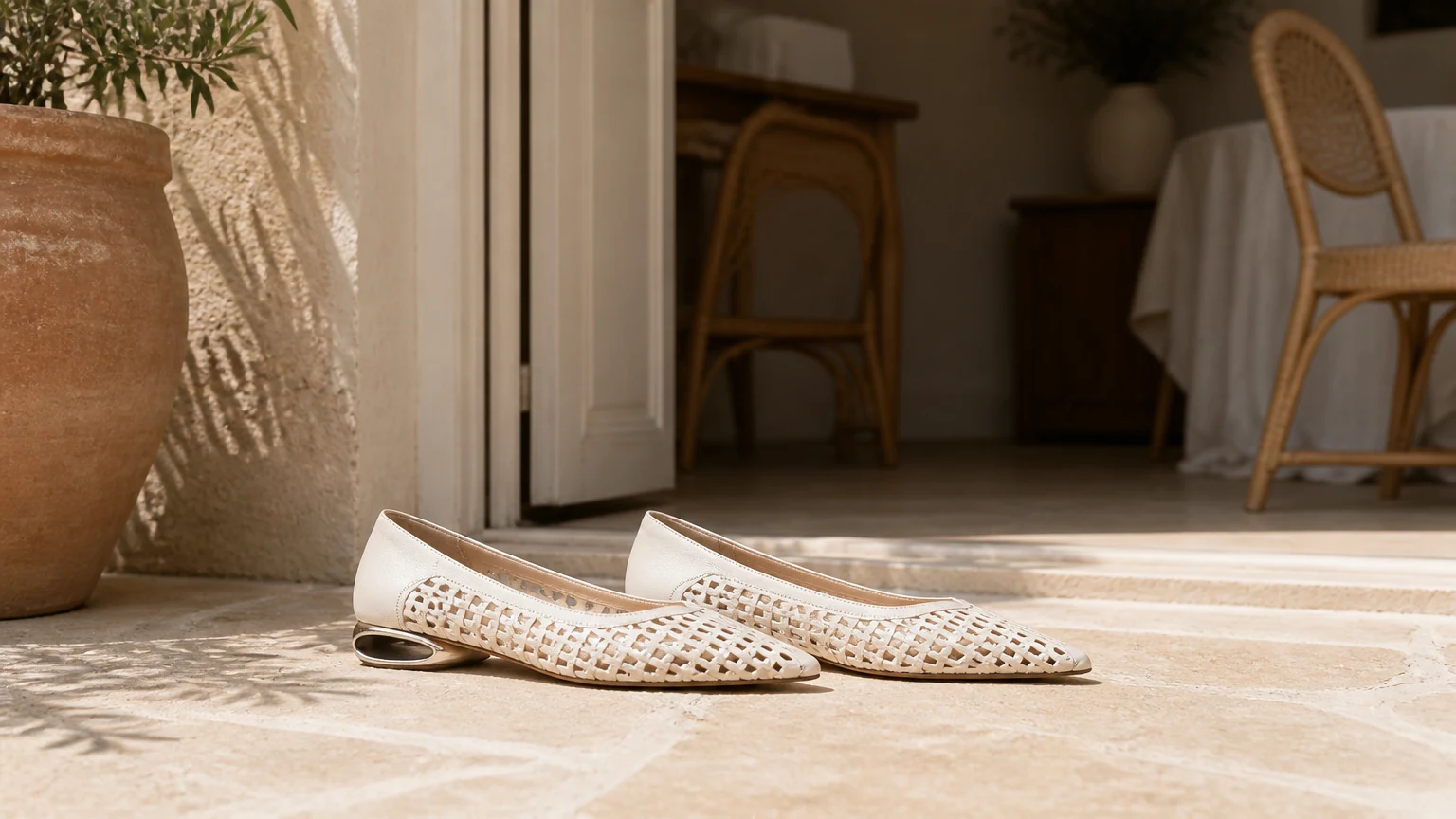 Textured pointed toe dress flats styled in a clean lifestyle setting