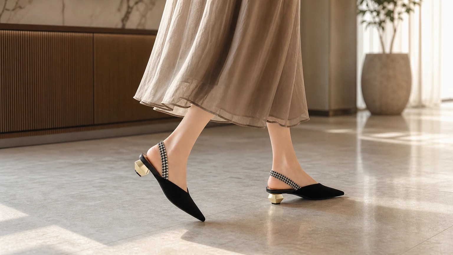 Minimalist black slingback office heels in a refined outfit scene