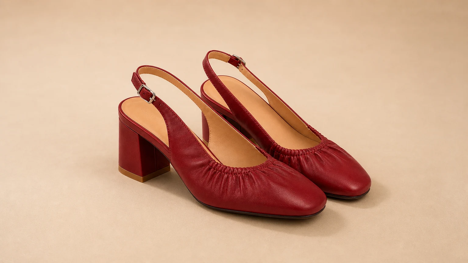 Soft gathered upper low block heel shoes styled in a warm editorial scene